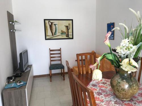 TV a/nebo společenská místnost v ubytování Casa Benedetta