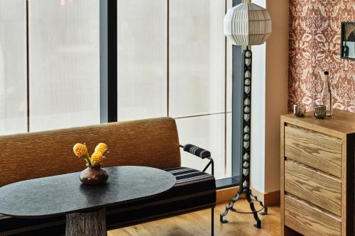 a dining room with a table and a microphone at Austin Proper Hotel, a Member of Design Hotels in Austin
