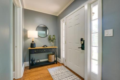 a hallway with a white door and a mirror at Fayetteville Vacation Rental - 1 Mi to Downtown! in Fayetteville