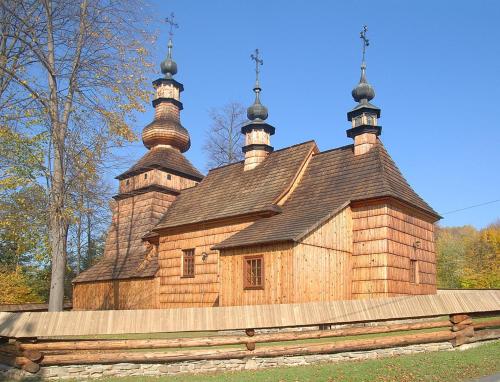 a building with two towers on top of it at Zagroda Kopytkowo in Ropica Górna