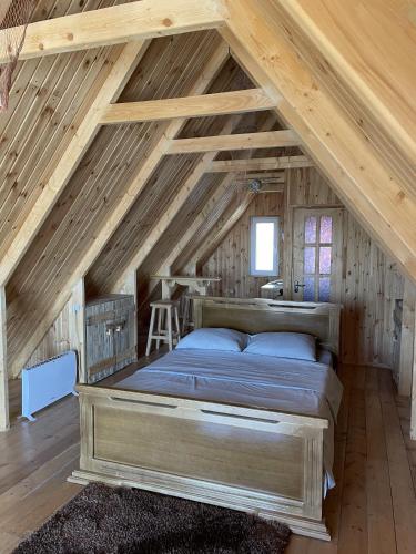 a bedroom with a bed in the attic at Armenian Camp, Sevan in Artanish