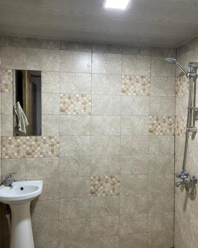 a bathroom with a sink and a toilet and a mirror at Armenian Camp, Sevan in Artanish