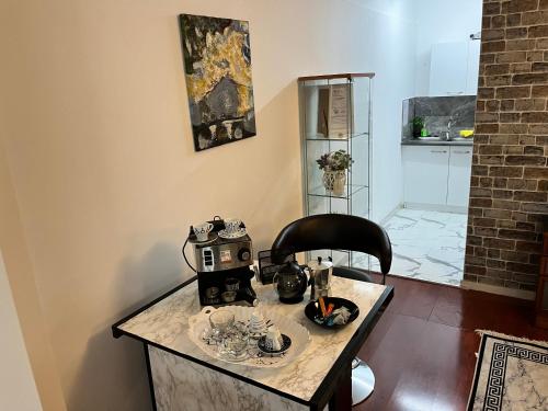 a room with a table with a tea set on it at Lovely Cozy Apartment in the entrance of Nicosia in Aglantzia