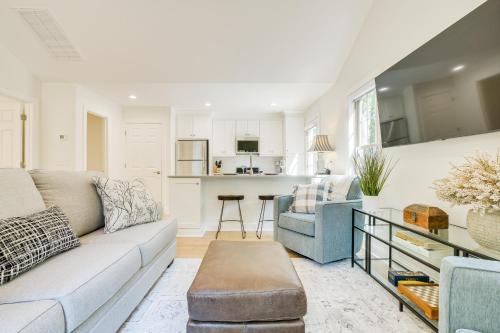a living room with a couch and a table at Beautiful Raleigh Cottage Rental 5 Mi to Downtown in Raleigh