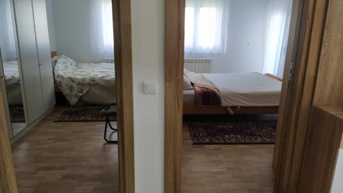 Postel nebo postele na pokoji v ubytování Apartman Daniela