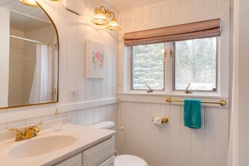 a bathroom with a sink and a toilet and a window at Rustic Mountain-View Farmhouse on 159 Acres in Lancaster