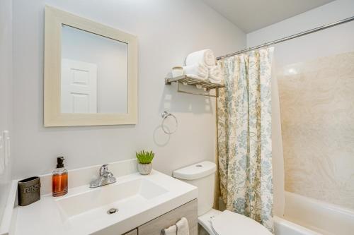 a bathroom with a sink and a toilet and a shower at Sunny Oakland Vacation Rental - 6 Mi to Downtown in Oakland