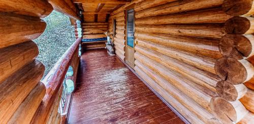 an inside view of a log cabin with wooden walls at Котедж в Карпатах in Huklyvyy