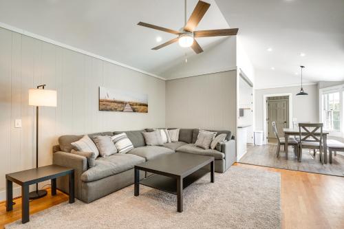 a living room with a couch and a ceiling fan at Wilmington Rental about 4 Mi to Wrightsville Beach! in Wilmington