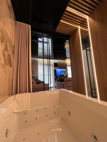 a large white bath tub in a room at Golden Life in Kielce