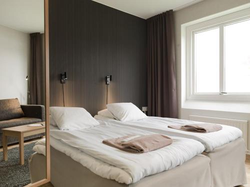Postel nebo postele na pokoji v ubytování Hotell Svanen