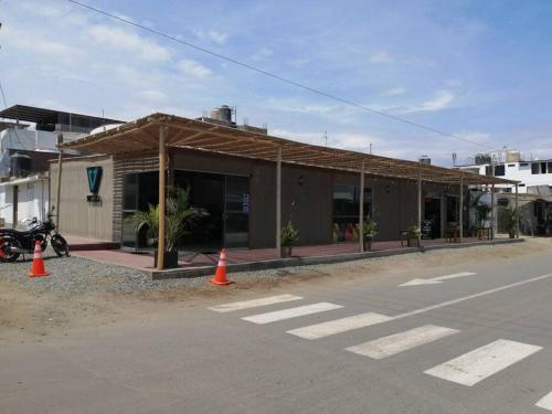 a building with orange cones in front of a street at J&B Aparment 2 Punta Hermosa in Punta Hermosa