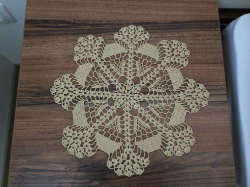 a mandala rug on a wood floor at Apartmaji Kranjska Gora in Kranjska Gora