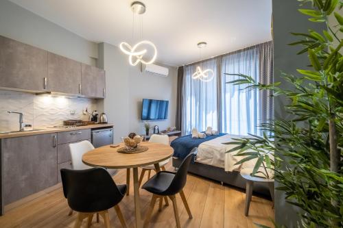 a bedroom with a bed and a table and chairs at Amazing Apartments @ Monastiraki Subway Station in Athens