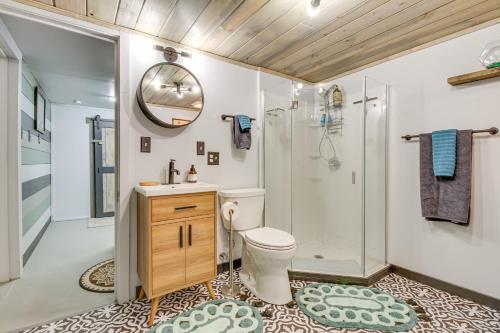 a bathroom with a shower and a toilet and a sink at Classic Butte Vacation Rental with Mountain Views! in Butte