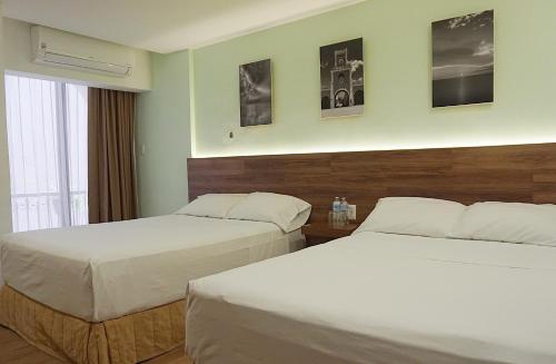 Ένα ή περισσότερα κρεβάτια σε δωμάτιο στο Hotel del Paseo Campeche