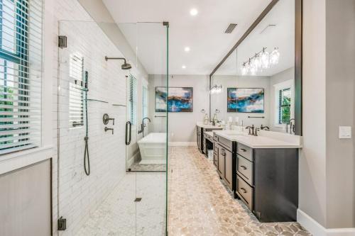 a bathroom with two sinks and a shower at The Big Top in Bailey Hall