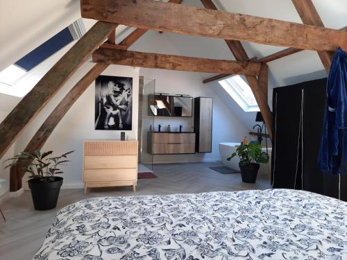 a bedroom with a large bed in a attic at Suite city center in quiet street & airco in Antwerp