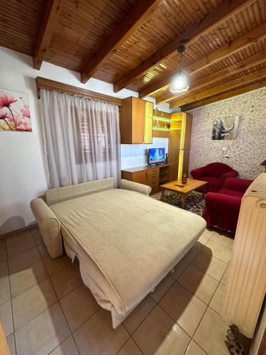 a bedroom with a large bed in a room at Bratis House 2 in Vartholomio