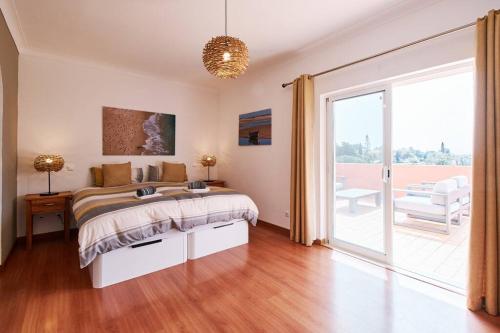 Ένα ή περισσότερα κρεβάτια σε δωμάτιο στο Casa Verao