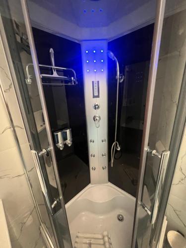 a small bathroom with a shower and a toilet at Apartman Paola - massage chair- 0-24 self check IN OUT- Županja in Županja