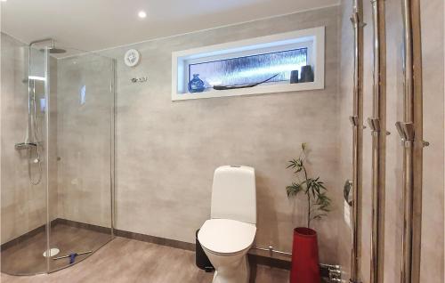 a bathroom with a toilet and a glass shower at Beautiful Home In Slen With 3 Bedrooms in Sälen