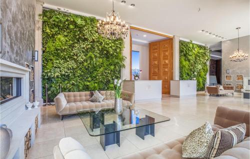 a living room with a large green wall at Prince in Binz