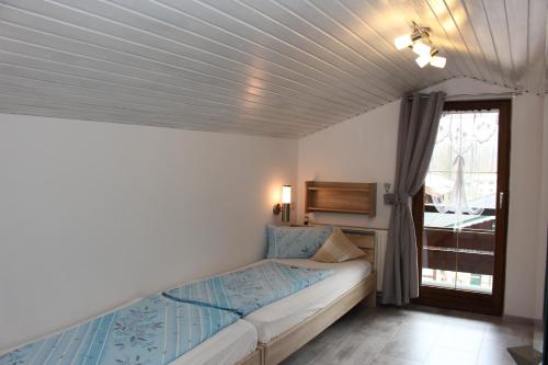 Postel nebo postele na pokoji v ubytování Gästehaus Stöckl