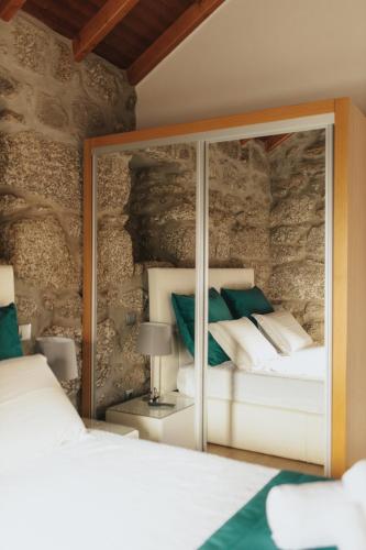 Ένα ή περισσότερα κρεβάτια σε δωμάτιο στο Quinta do Rabelo