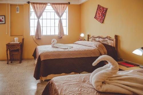 Postel nebo postele na pokoji v ubytování Hotel Shinula