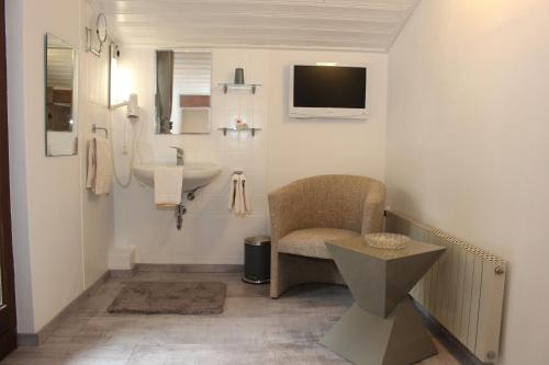 Ett badrum på Gästehaus Stöckl