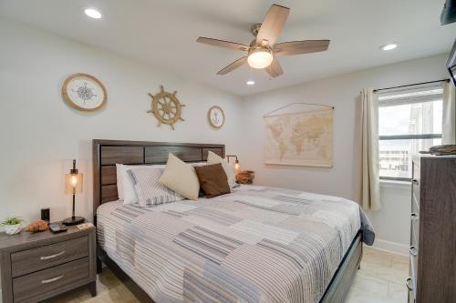 a bedroom with a bed and a ceiling fan at Vibrant Gulf Shores Getaway with Pool and Beach Access in Gulf Shores