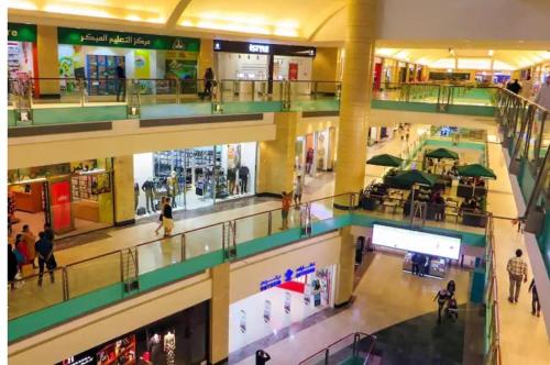 an overhead view of a shopping mall with people in it at MBZ - Nice Bed Space "MEN" in Abu Dhabi