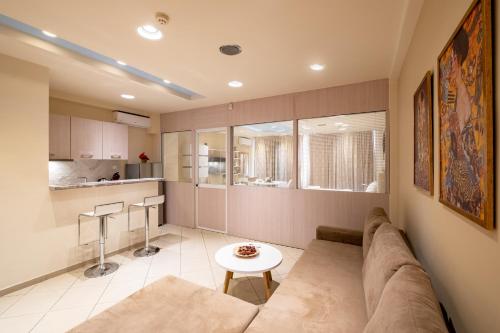 a living room with a couch and a table at Amazing Apartments @ Monastiraki Subway Station in Athens