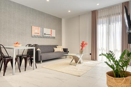 a living room with a couch and a table at Beco Santa Emilia 3M, a Home in Madeira in Funchal