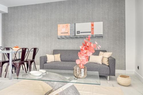 a living room with a couch and a table at Beco Santa Emilia 3M, a Home in Madeira in Funchal