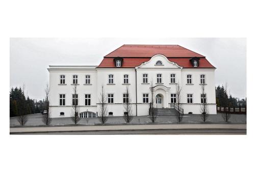 a rendering of a white house with a red roof at Palazzo Adler Swarzędz in Swarzędz