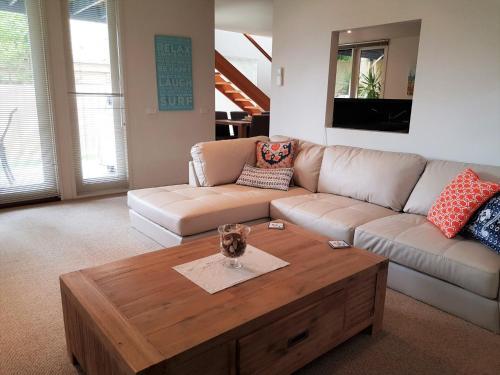 a living room with a couch and a coffee table at Lonsdale Shores in Point Lonsdale