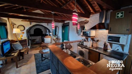 a kitchen with a sink and a counter top at Casa da Serreta 17 in Serreta