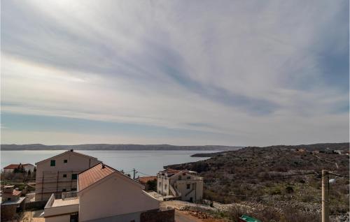 a view of a large body of water with buildings at Lovely Apartment In Ribarica - Karlobag in Matić Podi