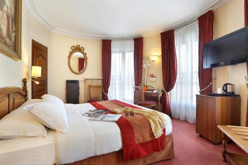a hotel room with a bed and a television at Hotel Paix Republique in Paris