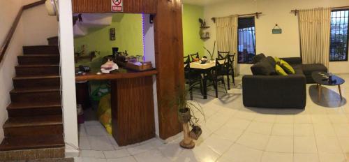 a living room with a kitchen and a dining room at Ocean View PLAYA DEL NIÑO Rooms & Apartments in Cancún