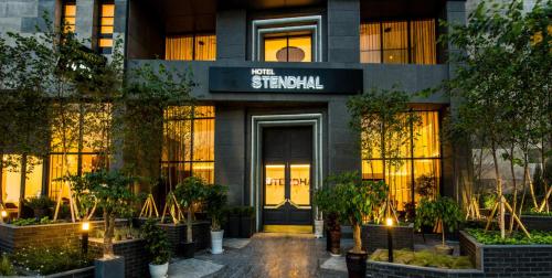 a building with a sign on the front of it at Le Stendal Hotel in Daejeon