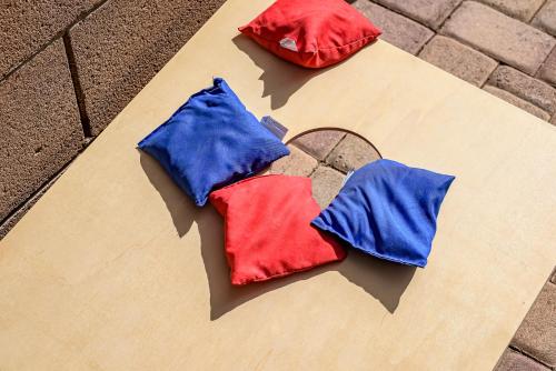 a group of three pillows sitting on a table at Chic Poolside Oasis - Karaoke - BBQ - Games in Phoenix