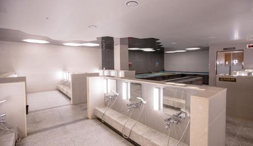a large kitchen with sinks and faucets at C-One Resort Jaeundo in Sinan