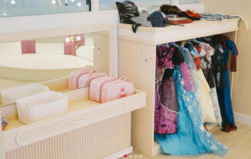 a dressing room with a shelf with clothes at C-One Resort Jaeundo in Sinan
