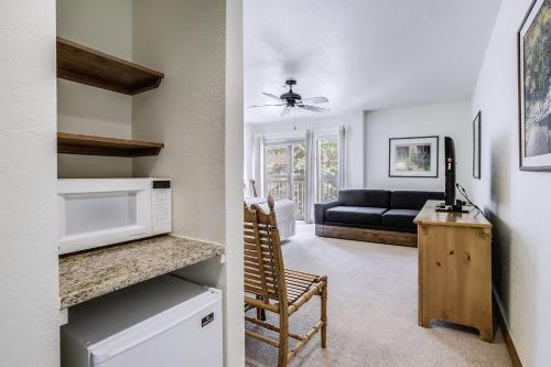 a kitchen and living room with a couch and a microwave at St. James Place in Beaver Creek