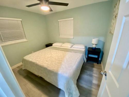 a bedroom with a bed and a ceiling fan at Serene renovated oasis near downtown area in Gainesville