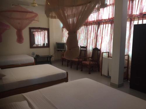 Postel nebo postele na pokoji v ubytování Hotel Shalini