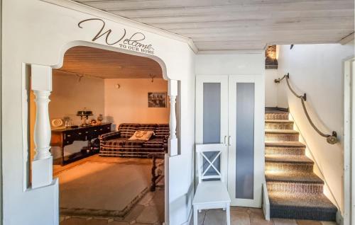 a hallway with a stairway leading to a living room at Lovely Home In Uddevalla With Kitchen in Uddevalla